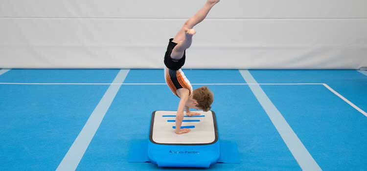 boy gymnast using airboard boost.jpg